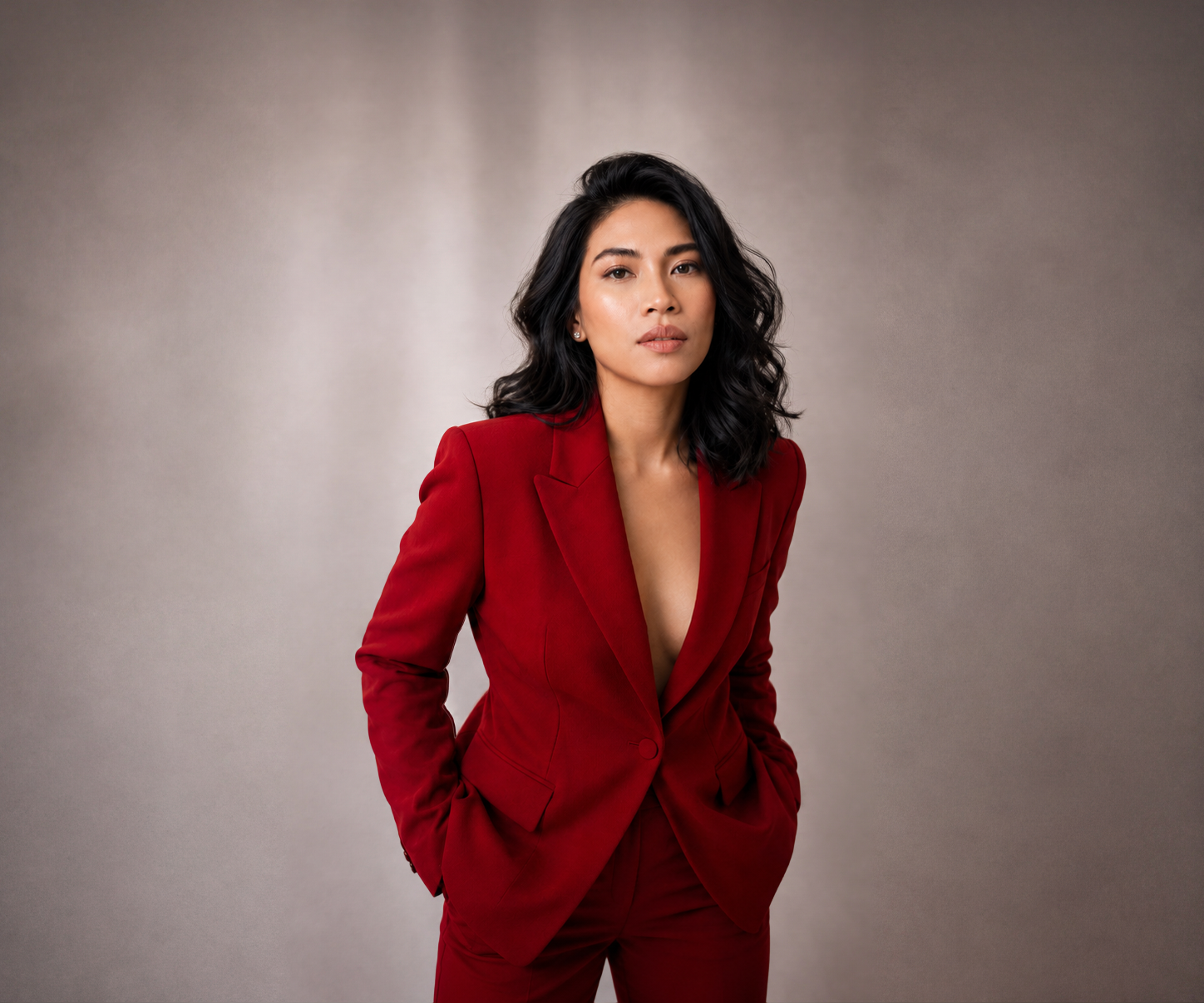 Ailene Tungala Tugna in a red tailored suit